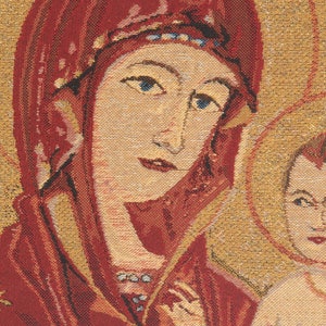 May include: A tapestry depicting the Virgin Mary with a crown and a red robe, holding a baby Jesus in her arms. The tapestry has a gold background with intricate details.