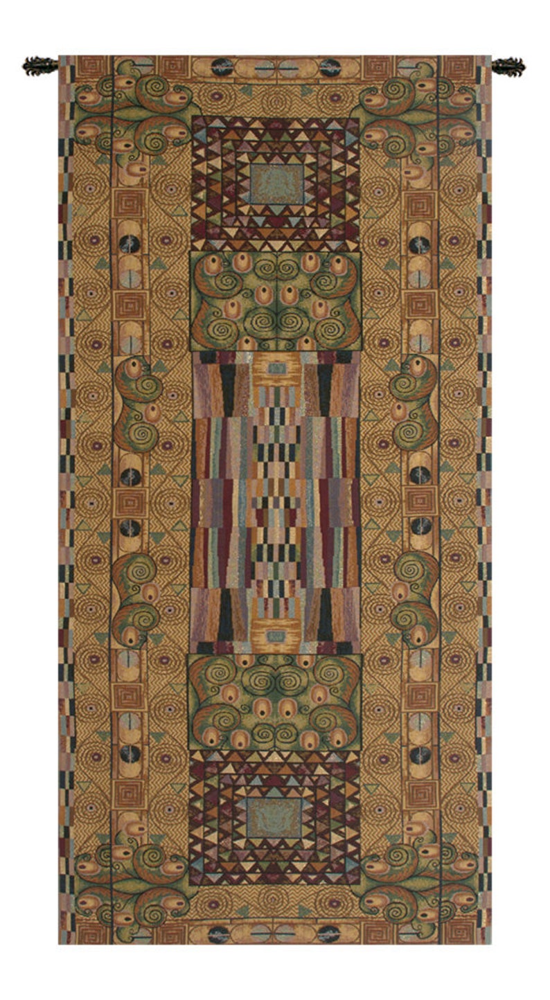 May include: A tapestry with a geometric pattern in shades of brown, green, red, and blue. The tapestry has a repeating pattern of circles, squares, and triangles. The tapestry is framed with a brown border.