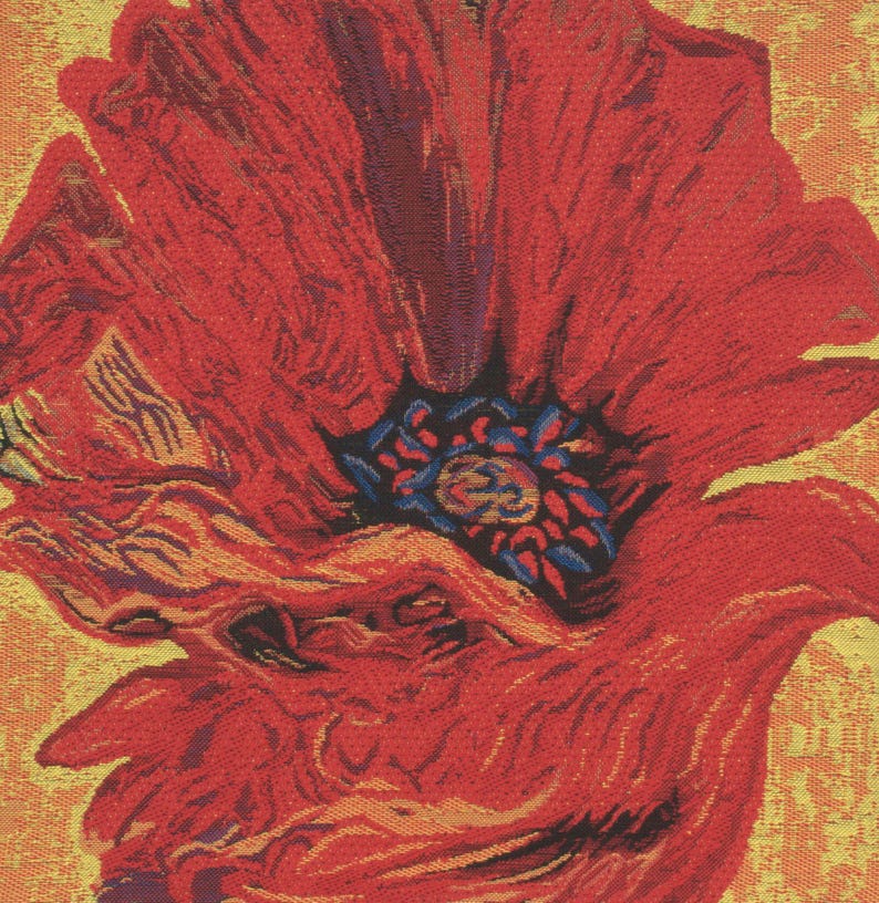 May include: A close-up of a red poppy flower with a yellow background. The flower has a textured, woven appearance and a dark blue center.