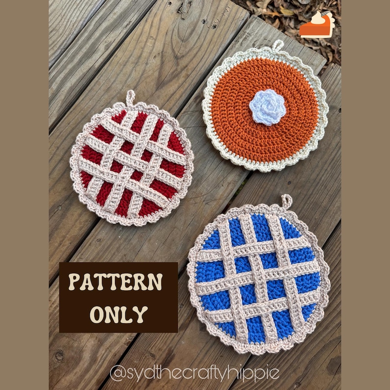 May include: Three crocheted pie-shaped pot holders in red, orange, and blue, each with a lattice crust design and a scalloped edge. The orange pie has a white flower in the center. The text "PATTERN ONLY" is visible. The pot holders are on a wooden surface.