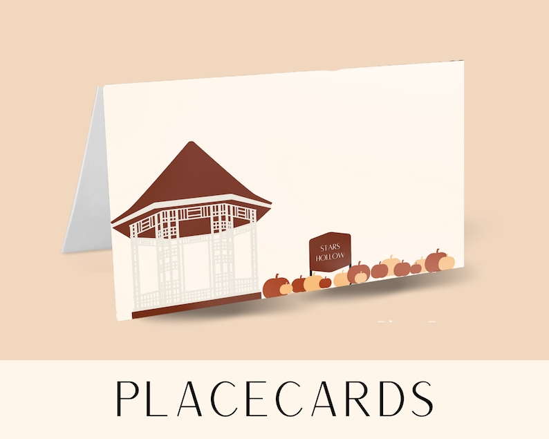 May include: Place card featuring a brown gazebo with a white lattice design and a sign that reads "Starr's Hollow". The card is decorated with orange pumpkins.