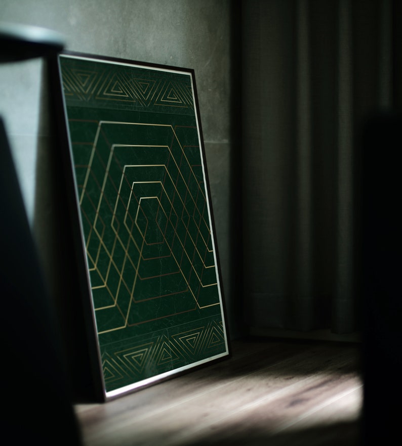 May include: A framed print with a geometric design in gold and green. The design features a series of overlapping squares and triangles.
