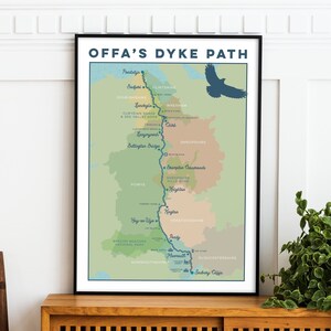 May include: A map of Offa's Dyke Path, a long-distance trail in Wales, with a green, brown, and blue colour scheme. The map shows the path winding through the countryside, with various towns and landmarks marked along the way.