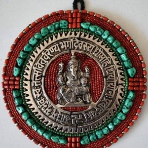 Tibetan Buddhist mantram, turquoise and coral with Tibetan silver motif. Buddhist decoration.