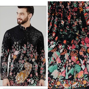 May include: A black long-sleeved shirt with a colorful floral and tiger print. The shirt has a mandarin collar and a button closure.