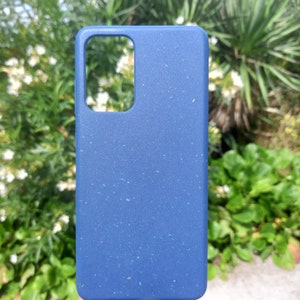 A navy blue case set amidst nature