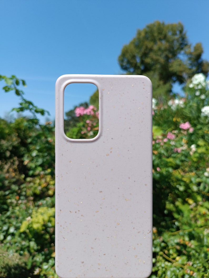 A beige case set amidst nature