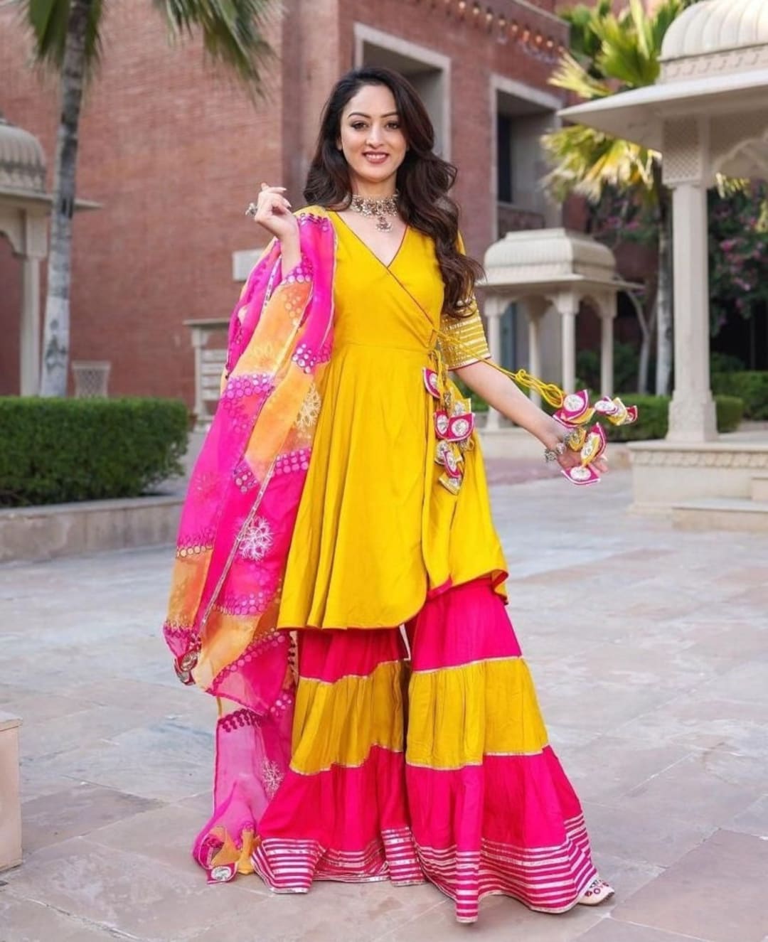 pink and yellow sharara suit
