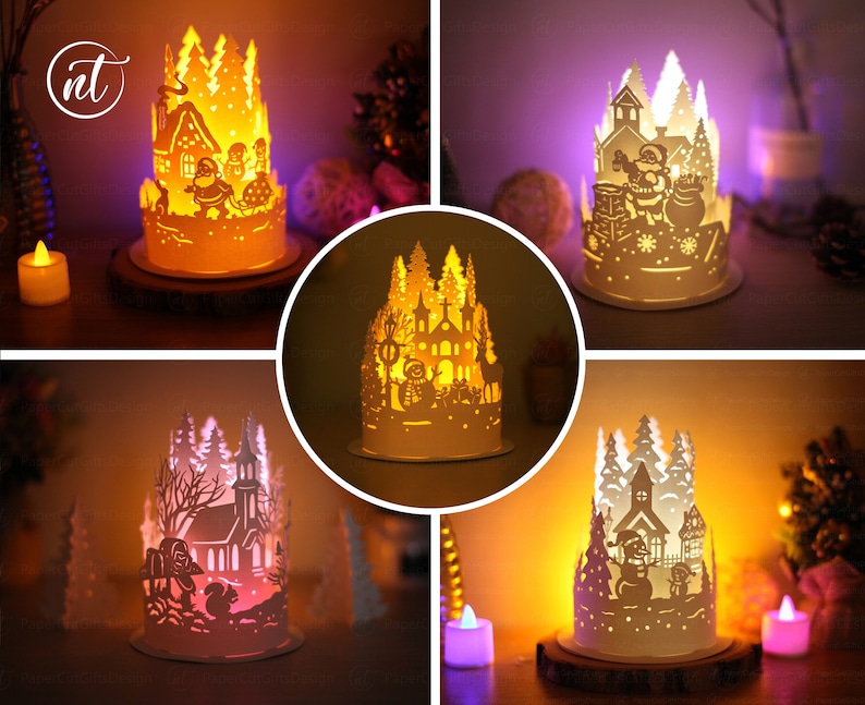 K&ouml;nnte beinhalten: Vier verschiedene leuchtende Weihnachtsdorfszenen aus Papier. Jede Szene zeigt eine Kirche, B&auml;ume und einen Schneemann. Die Szenen werden von innen beleuchtet und erzeugen ein warmes Leuchten.