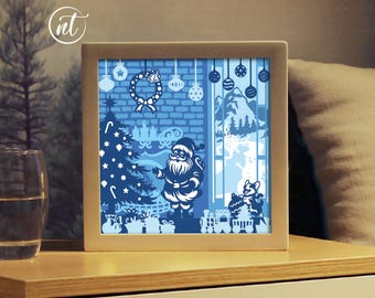 Santa Decorating Christmas Tree Light Box Template: Paper Cut Shadow Box (SVG, PDF)