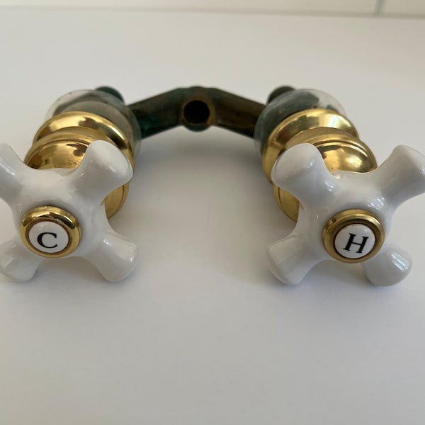 Vintage Porcelain Hot and Cold Taps with Brass Trim and Plumbing Fixture