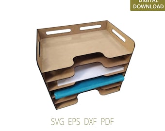 May include: A four-tiered wooden desktop organizer with a light brown finish. The organizer has a rectangular shape with rounded corners and is designed to hold papers, files, or other office supplies. The organizer is empty except for a few sheets of paper and a blue folder.