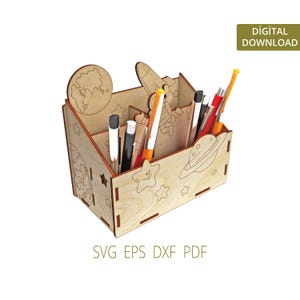 May include: A wooden desk organiser with a space theme. It features a rocket, planets, and stars. The organiser has multiple compartments for pens, pencils, and other office supplies. SVG EPS DXF PDF DIGITAL DOWNLOAD
