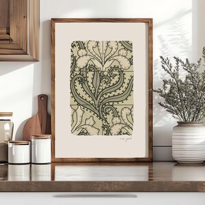 May include: A framed art print featuring a stylized floral design in shades of beige, gray, and black. The artwork has a vintage aesthetic and is displayed in a wooden frame. The print is labeled "new york" in the bottom right corner.