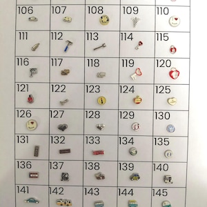 May include: A grid of small, silver-toned charms, each with a unique design. The charms include symbols like hearts, keys, vehicles, and various other shapes. The numbers 101 through 150 are printed above each charm.