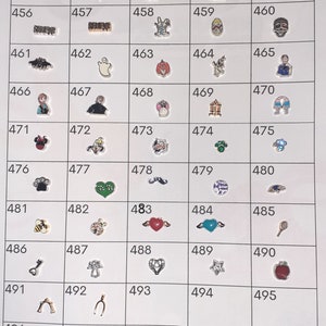 May include: A grid of 50 small charm pendants, each with a different design. The charms are made of metal and feature a variety of colors, including red, green, blue, yellow, and black. Some of the charms have a shiny finish, while others have a matte finish. The charms are arranged in rows and columns, and each charm is numbered.