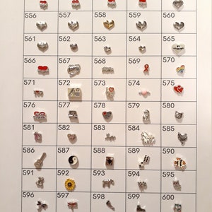 May include: A white background with a grid of 60 silver charms. Each charm has a different design, including hearts, animals, words, and symbols. The charms are numbered from 551 to 600.
