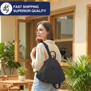 May include: A black backpack with adjustable straps is worn over the shoulder. The backpack has a rounded shape with a small pocket on the front. The text "FAST SHIPPING SUPERIOR QUALITY" is in a blue rectangle.