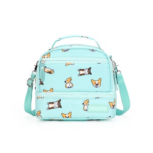 May include: A turquoise blue lunch bag with a double zipper closure and an adjustable shoulder strap. The bag features a repeating pattern of cartoon corgis and the text "Bagitory".