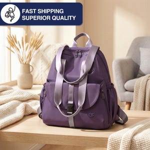 May include: A purple backpack with gray straps and a black buckle. The bag has a top handle and two zippered compartments. The text "FAST SHIPPING SUPERIOR QUALITY" is in a blue rectangle in the upper left corner.