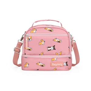 May include: Pink double-decker lunch bag with a zipper closure and adjustable shoulder strap. The bag features a repeating pattern of cartoon corgis in various poses. The bag has a label that reads "Baystory".