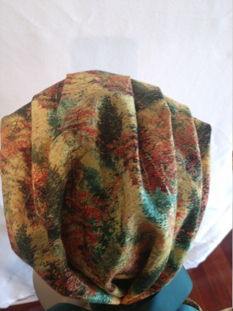 My nursing caps are handmade in my clean home.One size fits all using adjustable elastic with toggle and ribbon ties.Buttons to wear masks.