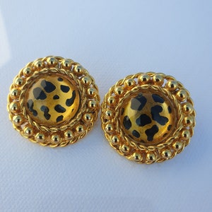 Vintage round clip on earrings with plastic leopard cabochons