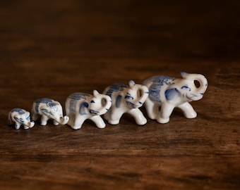 A family of 5 white and blue porcelain elephants figurine