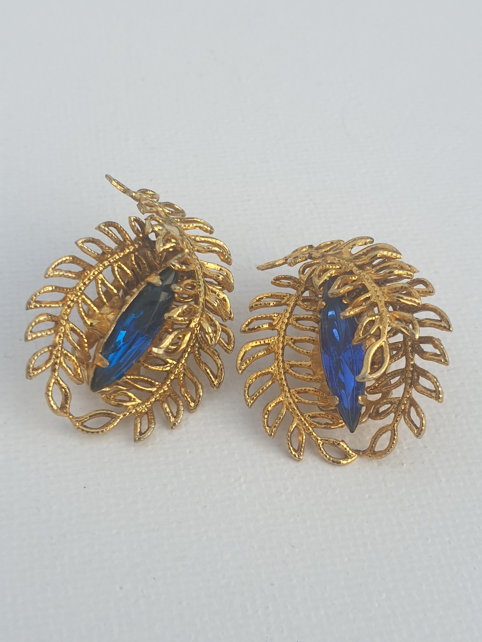 Vintage Gold Tone Clips on Earrings With a Bright Blue Glass Crystal