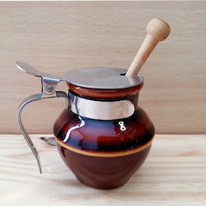 Small glazed ceramic mustard or honey pot with small wooden spoon in bistro style - French vintage