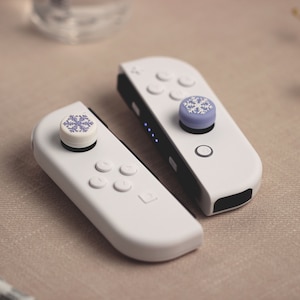 Purple Snowflake Thumb Grip Cap for Nintendo Switch/Lite Joy-Con (1 Pair)