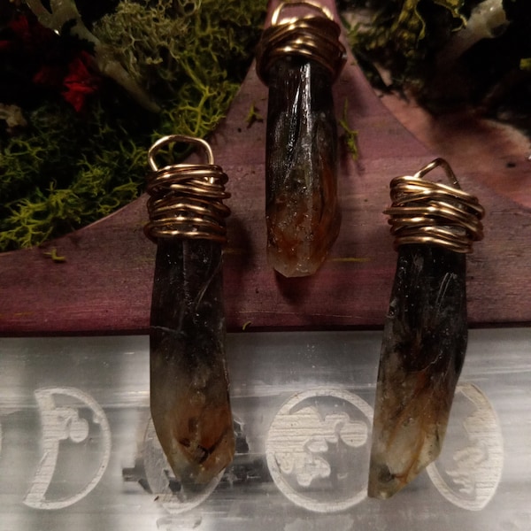 House finch feathers crystal pendants. Whimsigoth. Oddities. Cottagecore. Fairycore. Fae. Gobo. Witchy. Occult.