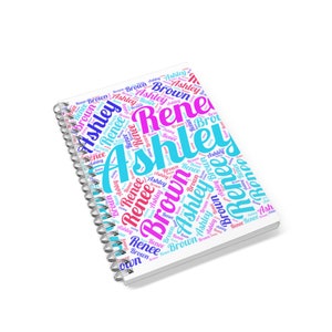 Puede incluir: Una libreta de espiral blanca con un diseño de nube de palabras colorido con los nombres "Ashley" y "Renee".