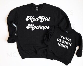May include: Two black crewneck sweatshirts. The larger sweatshirt has the text "Mod Girl Mockups" in white. The smaller sweatshirt has the text "Your Design Here" in white.