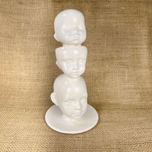 Ceramic Doll Heads Sculpture: Creepy Assemblage Art