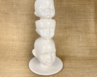 Ceramic Doll Heads Sculpture: Creepy Assemblage Art