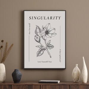 May include: Black and white print with a floral illustration of a magnolia flower. The print has the text "SINGULARITY" at the top and the text "Have I lost myself?" on the left side and "Or have I gained you?" on the right side. The text "Love Yourself: Tear" is at the bottom of the print.