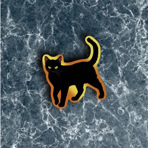 May include: A black cat with yellow eyes is walking on a gray and white marble background. The cat is outlined in a yellow glow.