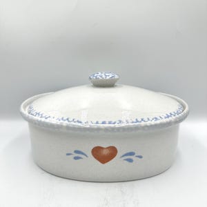 May include: A white ceramic mug with a black handle and the text "But First, Coffee" in a black, bold font. The mug is sitting on a wooden surface. The mug is a standard 11 oz size.