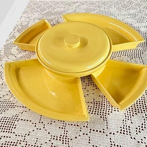 May include: A set of three ceramic mugs with a speckled, matte finish in cream, light grey, and dark grey. Each mug has a simple, minimalist design, suitable for coffee or tea.