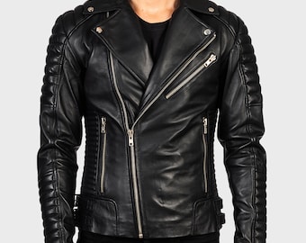 May include: Black leather jacket with an asymmetrical zipper closure, notched lapels, and quilted detailing on the shoulders and sleeves. The jacket has multiple zippered pockets and a snap-down collar. A classic biker style.