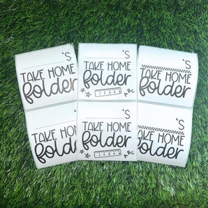 May include: Five white labels with black text that reads "Take Home Folder" with a ruler and stars on some of the labels.