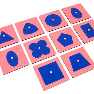 May include: Nine pink square tiles with blue shapes cut out of the center. The shapes include a circle, oval, triangle, square, rectangle, pentagon, heart, and flower.