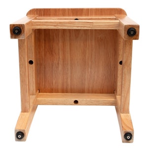 Close-up of the ladder-back design on the 14-inch wooden toddler chair, showing the sturdy construction and natural wood grain finish.