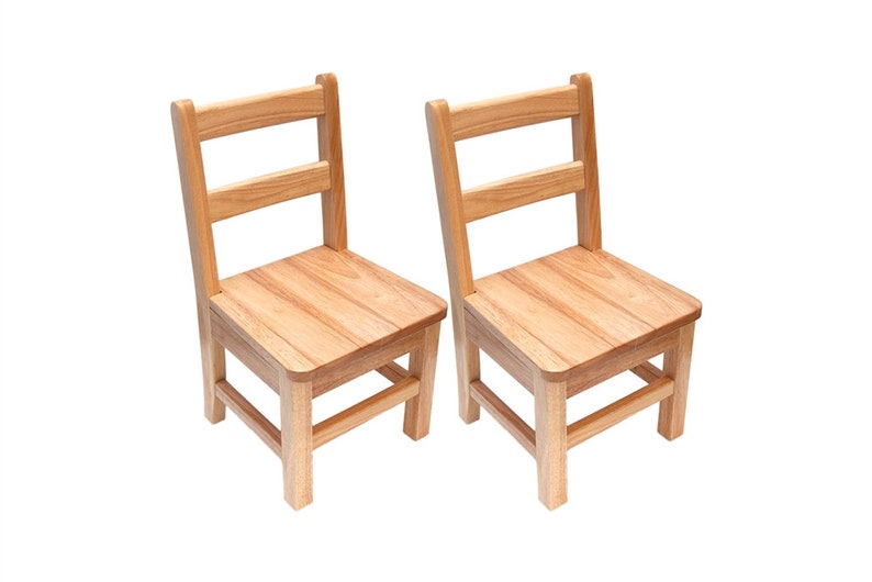 Natural solid wood Montessori chair with 14 inch seat height, positioned at a light wood activity table in a sunny classroom setting with a wooden puzzle.