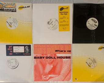 May include: A collection of six vinyl records in square sleeves. The covers feature various designs including yellow, white, and black backgrounds with text such as Umboza Sunshine, Individual Sky High, Toni Shannon, and Baby Doll House.