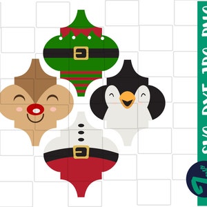 Puede incluir: Cuatro adornos navideños con forma de reno, pingüino, elfo y Papá Noel. Cada adorno es de un color diferente y tiene una expresión facial diferente.