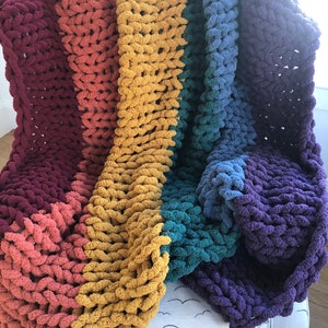 Beautiful handmade chunky knit blankets in a variety of colors, sizes and personalize with custom colors.  Ultra soft and cozy, machine washable and kid and pet friendly.  Chenille yarn that does not shed.  Perfect for gift giving or yourself!