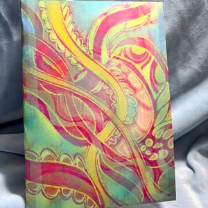 May include: A colorful abstract painting with a paisley pattern in shades of pink, yellow, and green. The painting has a watercolor effect and is on a textured paper.