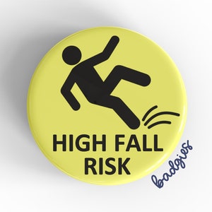 May include: Yellow round button with a black stick figure falling down and the text "HIGH FALL RISK".